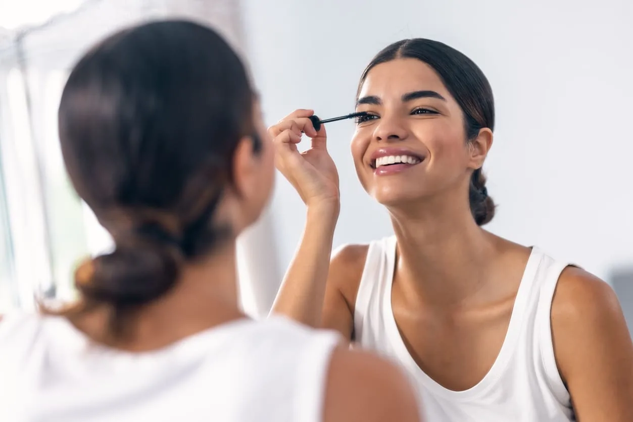 A woman enjoying her beauty routine